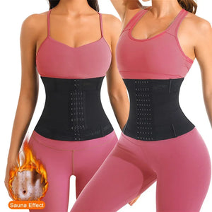 Two women wearing pink sports bras and pink leggings with black waist trainers, highlighting the 'Sauna Effect' feature.