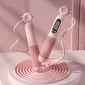 Pink Smart jump rope with digital counter on a pink background