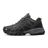 Black hiking shoe with orange accents on a white background.
