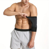 Man wearing a black elbow support on a white background
