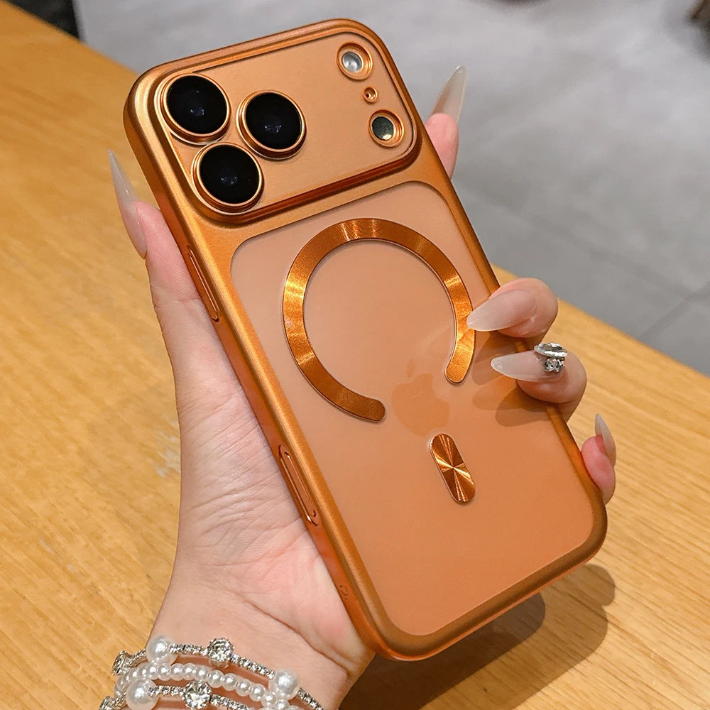 Hand holding a gold phone case with a wooden background