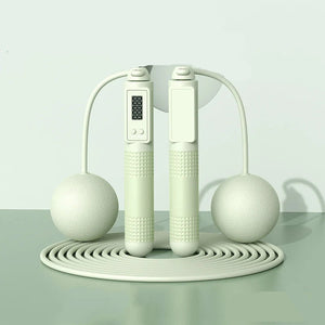 White jump rope with digital display on a light gray background, labeled 'Dual purpose' and 'Green'.