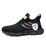 Black sneaker with colorful sole and brand tag on a white background