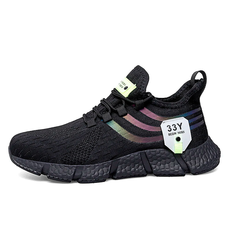 Black sneaker with colorful sole and brand tag on a white background
