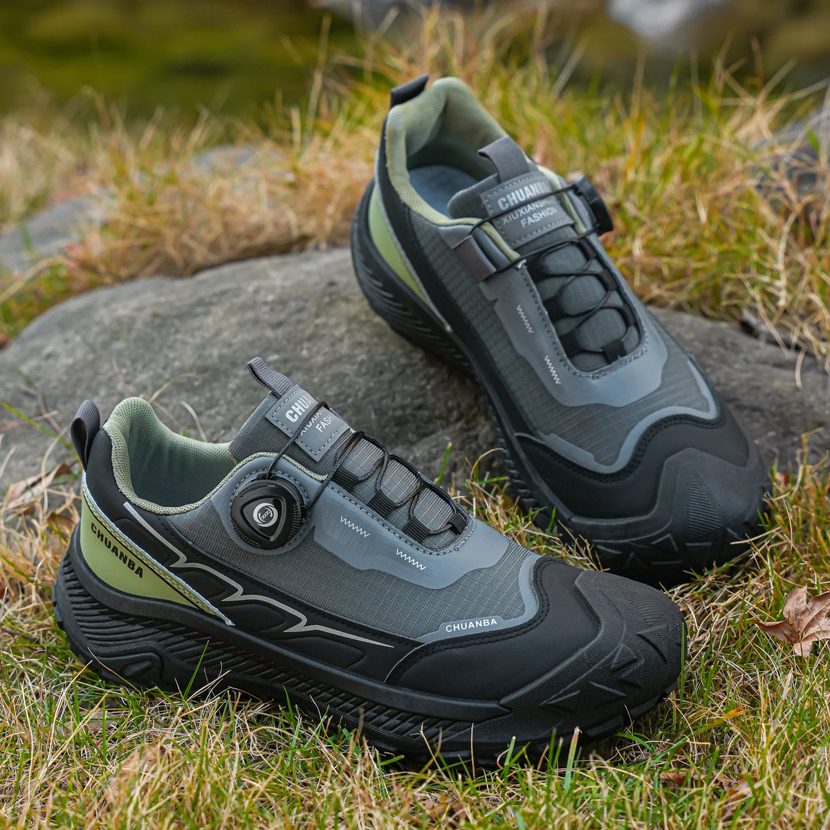 Pair of black and gray hiking shoes on a natural background