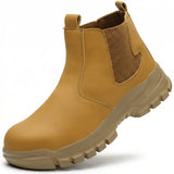A single tan Chelsea-style safety work boot with a thick beige lug sole, shown on a clean white background.