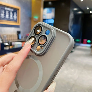 Phone case with camera lens protector held by a hand in an indoor setting