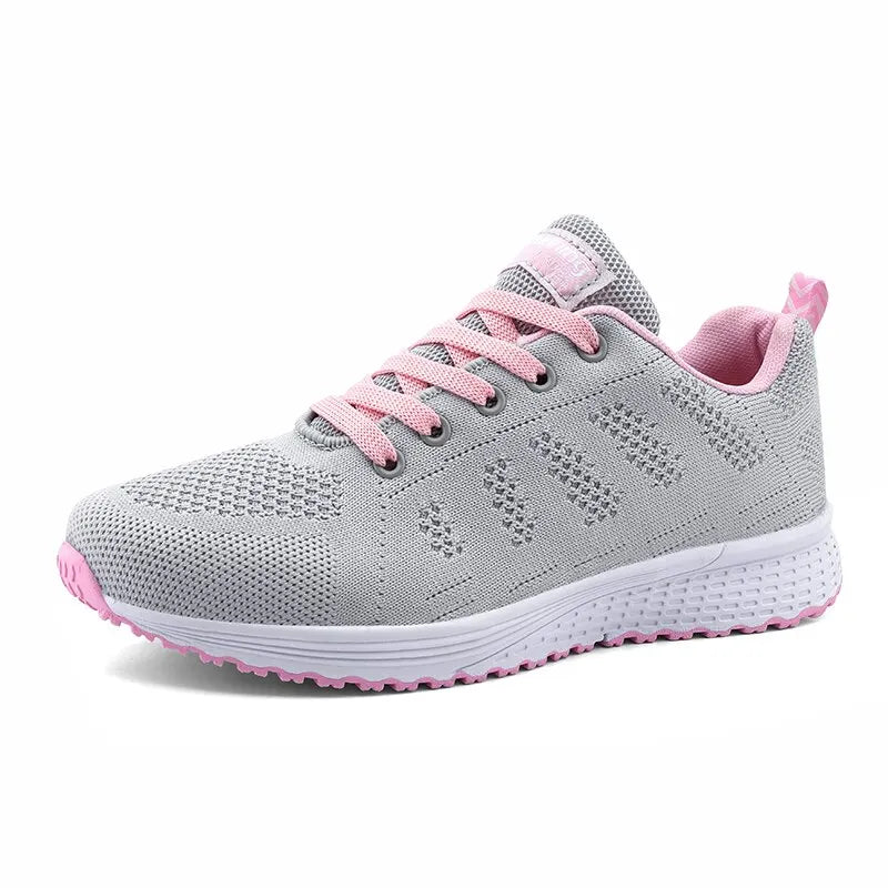 Gray running shoe with pink accents on a white background