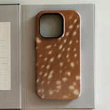 Wooden iphone case with deer pattern on a light gray background