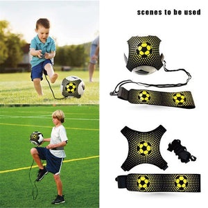 Children using a soccer training device on a grass field with additional devices displayed.