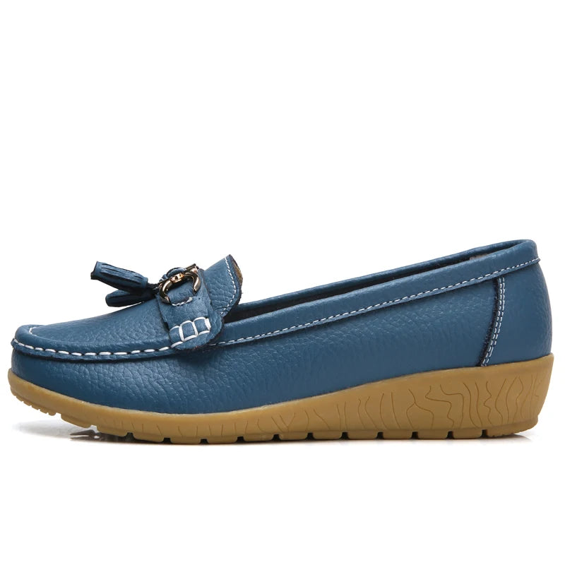 Women's leather loafers with metal tassel detail, round toe, and rubber sole