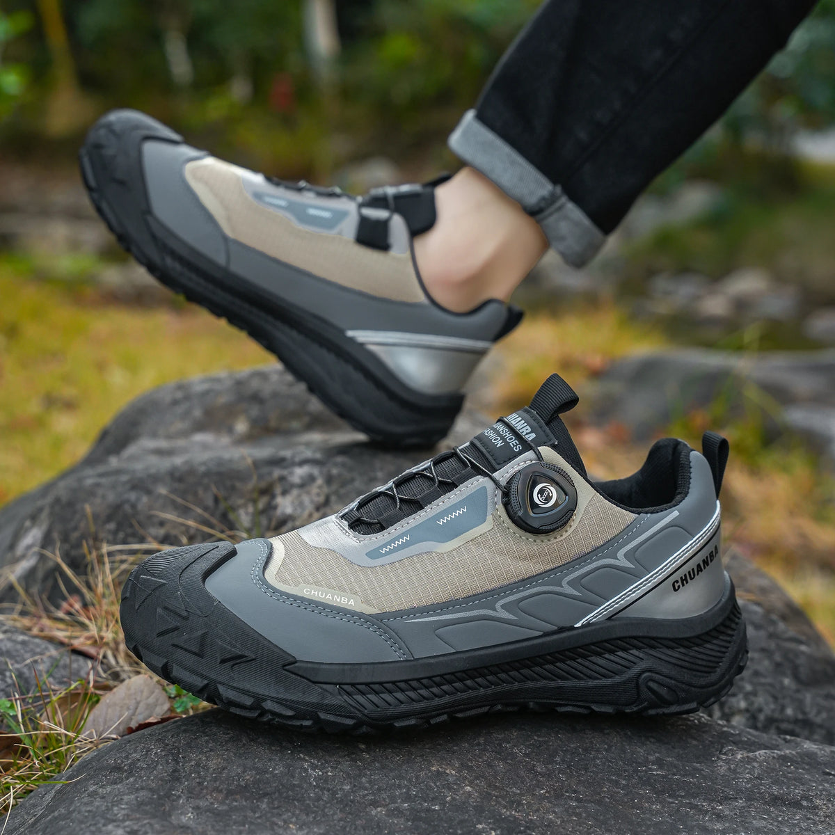 Hiking shoes on a rock with a natural outdoor background