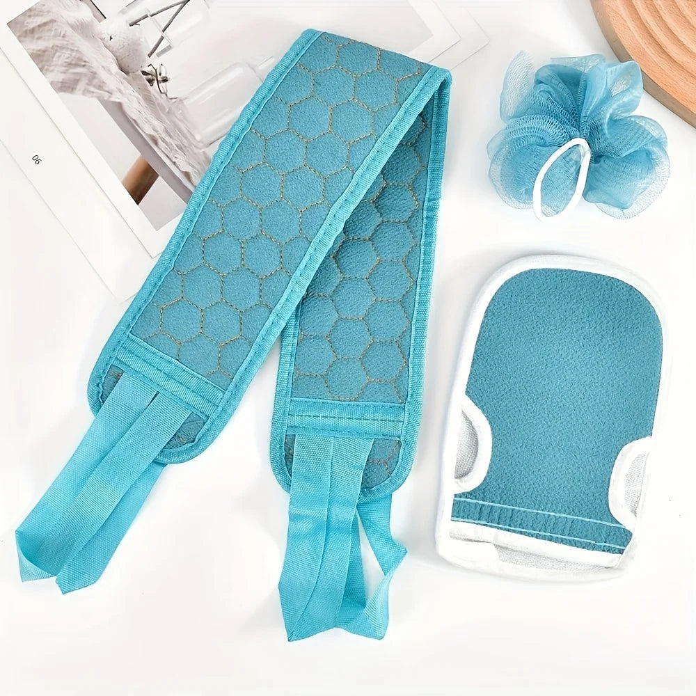 Set of blue bath mitt, scrubber, and loofah on a white surface