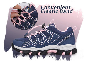 A navy blue athletic sneaker with pink laces and pink accents, shown on a white and pink graphic background. A circular inset highlights the elastic lacing system, and the text reads 'Convenient Elastic Band.