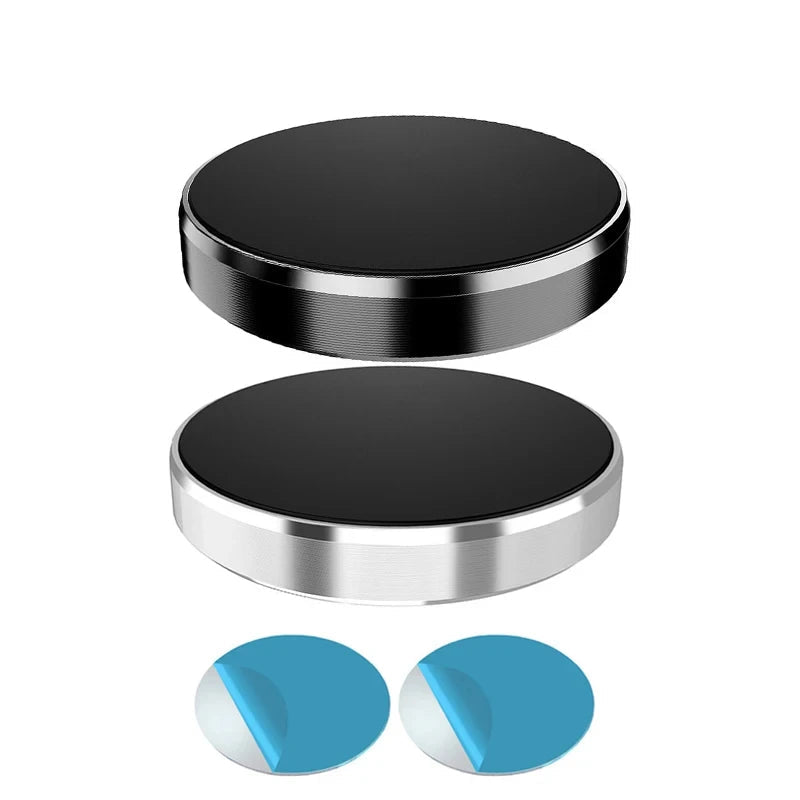 Two black metal plates with silver edges on a white background, accompanied by two blue circular objects.