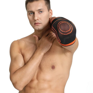 Man wearing a black and orange elbow support on a white background