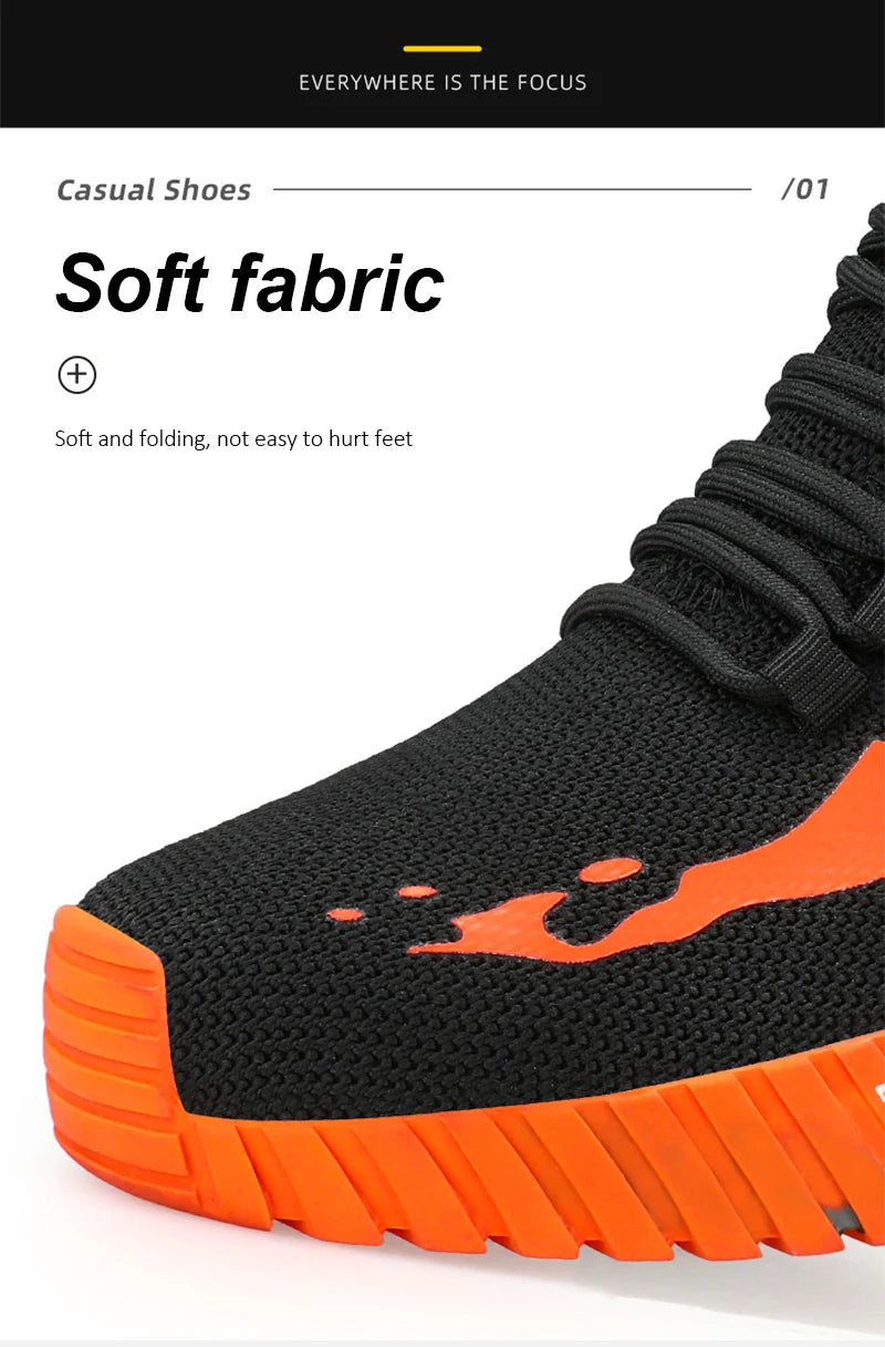 Black and orange safety work boot with soft fabric description on a white background
