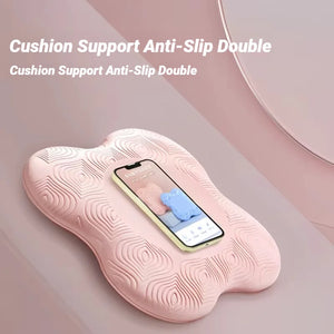 Pink cushion with anti-slip design holding a smartphone on a pink background