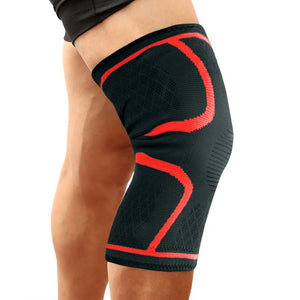 Red Black knee brace with red accents on a person's knee, on a white background.