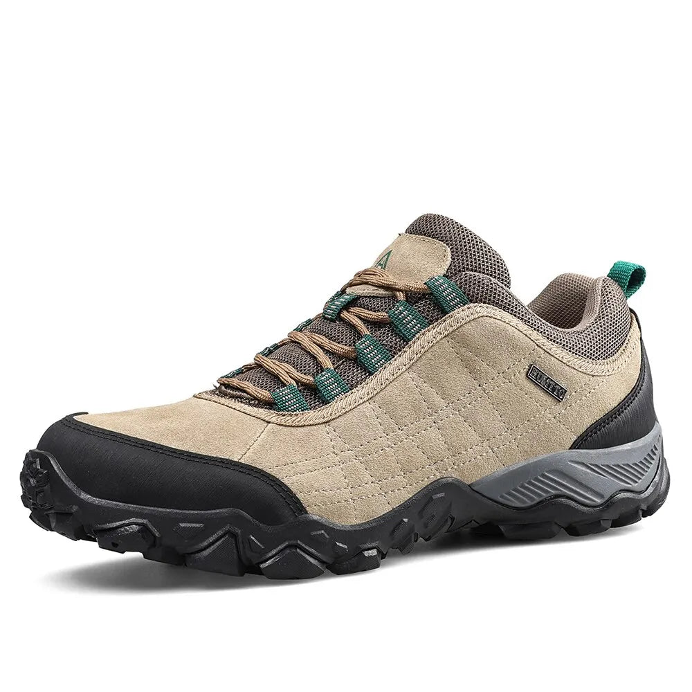 Beige hiking shoe with black sole on a white background