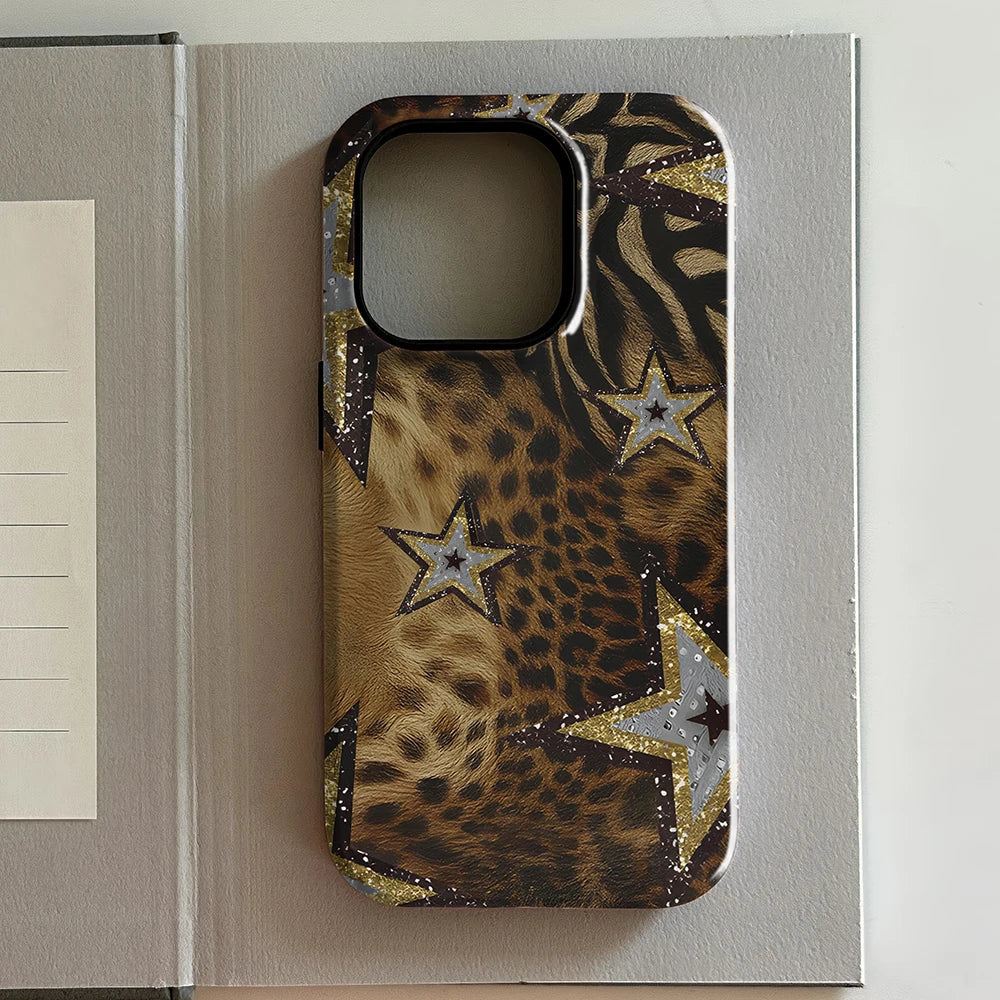 iPhone case with leopard print and star design on a light gray surface