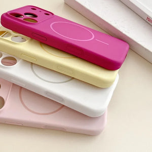 Stack of colorful phone cases on a light surface