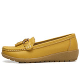 Women's leather loafers with metal tassel detail, round toe, and rubber sole