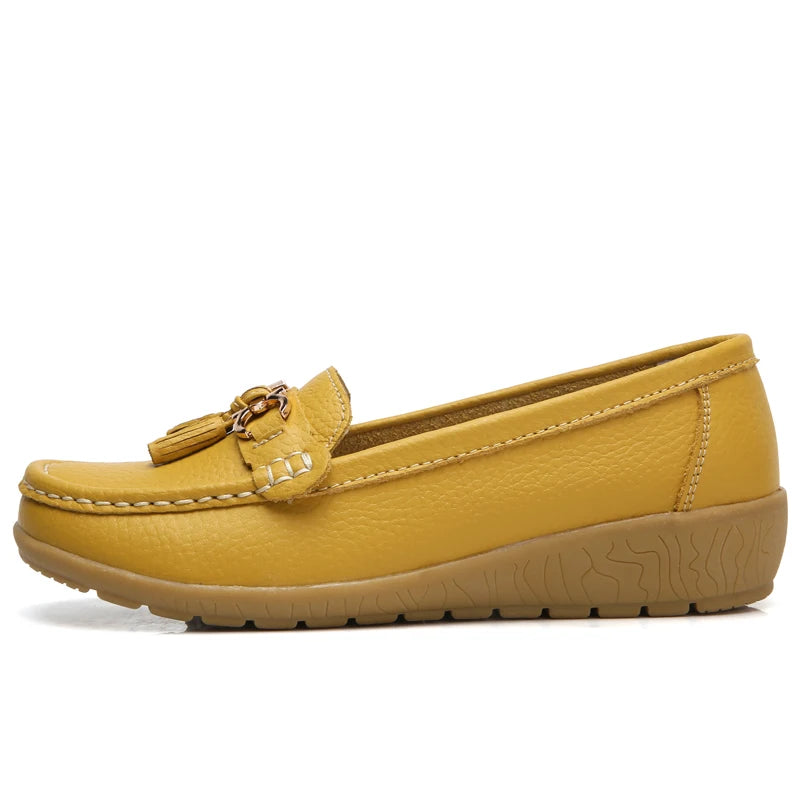 Women's leather loafers with metal tassel detail, round toe, and rubber sole