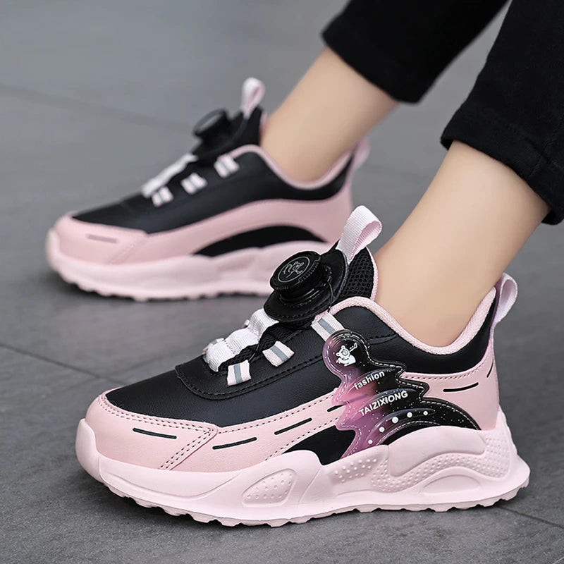 Pink and black sneakers with a visible brand logo on a gray floor.