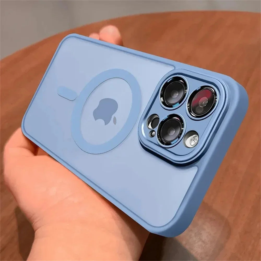 Blue Matte translucent magnetic iPhone case with camera lens protection and MagSafe held by a hand on a wooden surface