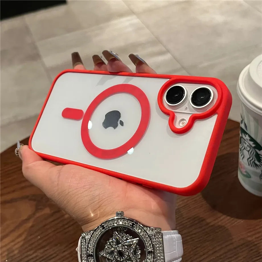 iPhone case with red border held by a hand on a wooden surface