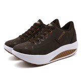 Brown fashion sneakers with white soles on a white background