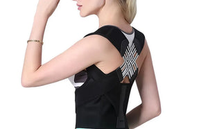 Woman wearing a black back brace with geometric design on a white background