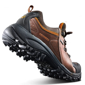 Brown hiking shoe with black sole on a white background.