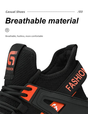 Black and orange safety work boot with breathable material feature on a white background