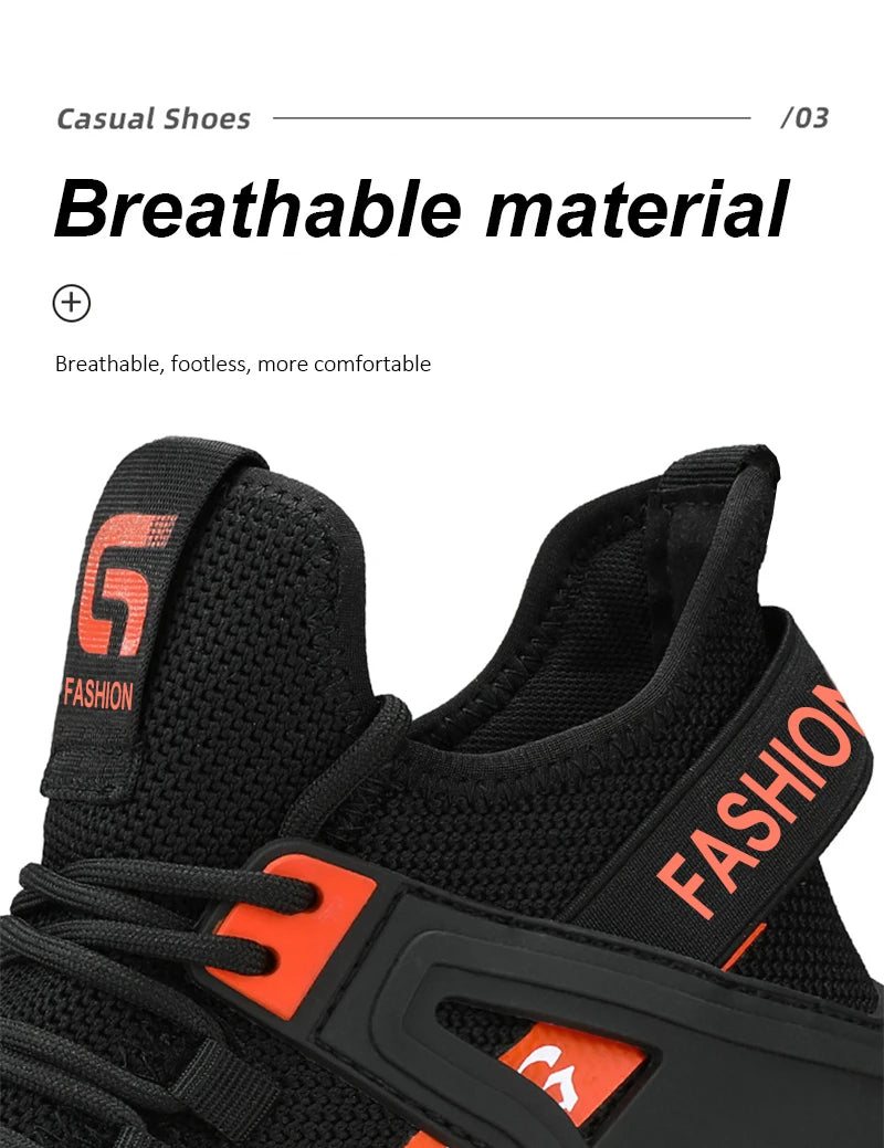 Black and orange safety work boot with breathable material feature on a white background