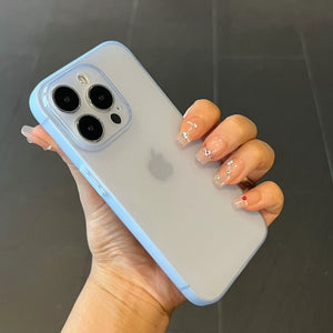 Hand holding a Ultra thin matte translucent TPU iPhone clear case and blue edge against a dark background
