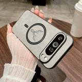 Leather Magnetic Case for Pixel with a scorpion design held by a person on a wooden table.