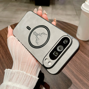 Leather Magnetic Case for Pixel with a scorpion design held by a person on a wooden table.