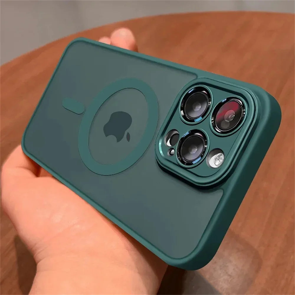 Green Matte translucent magnetic iPhone case with camera lens protection and MagSafe held by a hand on a wooden surface