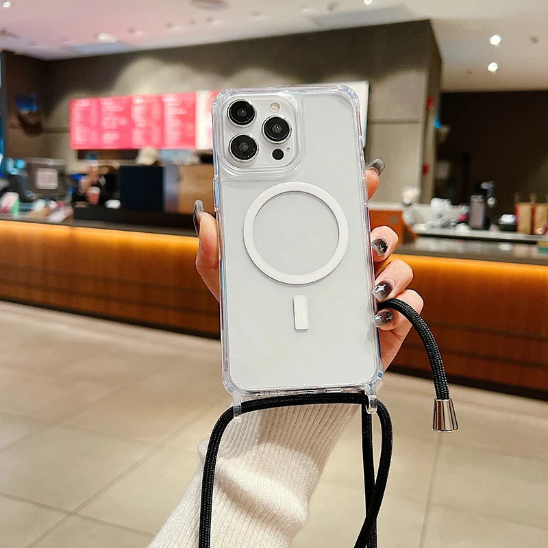 Person holding a phone with a clear case and magnetic strap in a blurred indoor setting