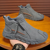 Gray ankle boots with a zipper on a wooden surface