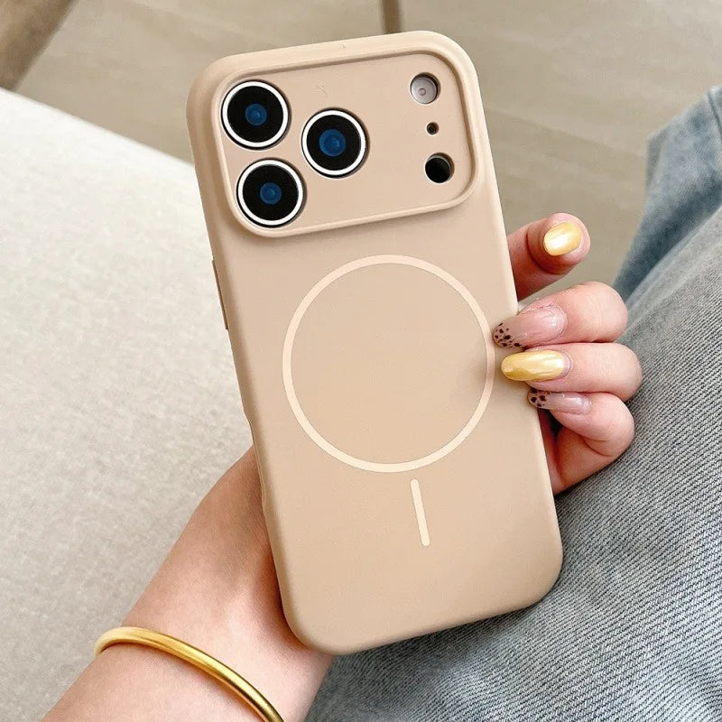 Beige phone case with a magnetic charging pad held by a hand.