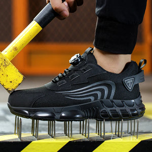 Black safety shoes with a yellow and black striped platform on a blurred background